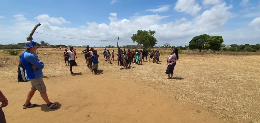 Children play an outdoor game during camp