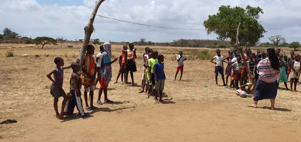 Children take part in a team game outdoors