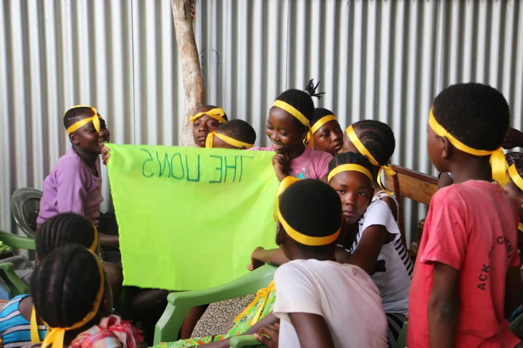 Camp participants give a creative presentation