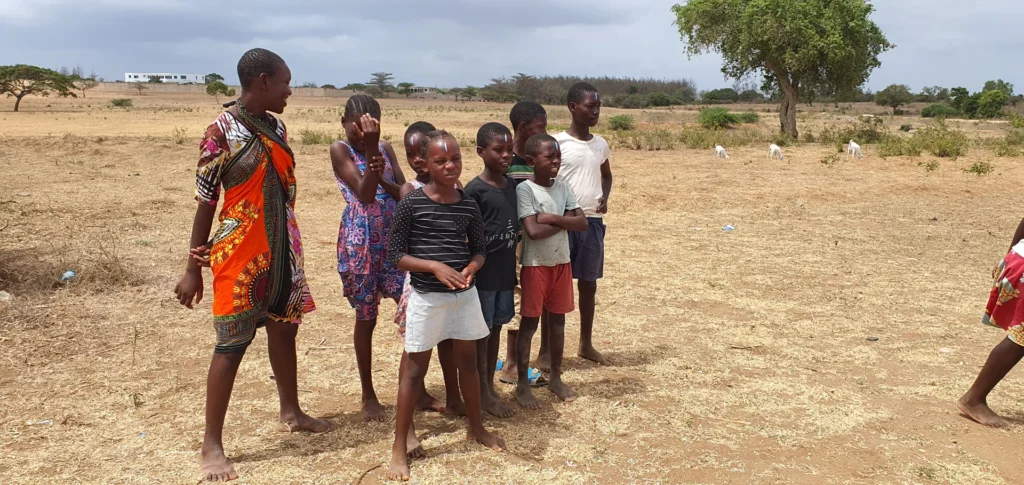 Children prepare for a camp relay race