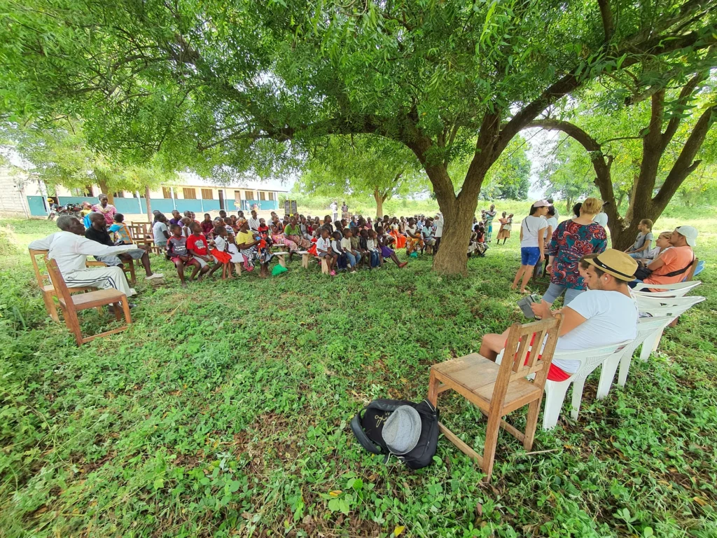 Children receive meals during an outdoor program