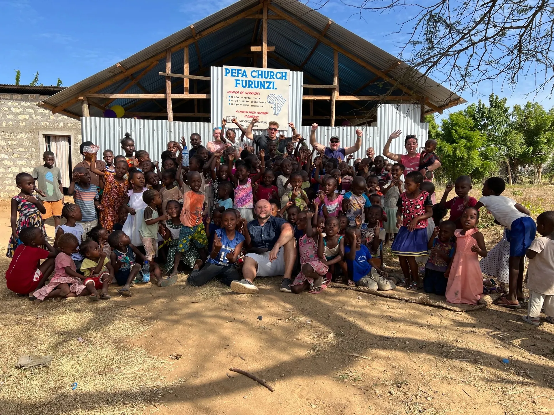 Children and volunteers at a Bring Life Mission Christian camp in Kenya