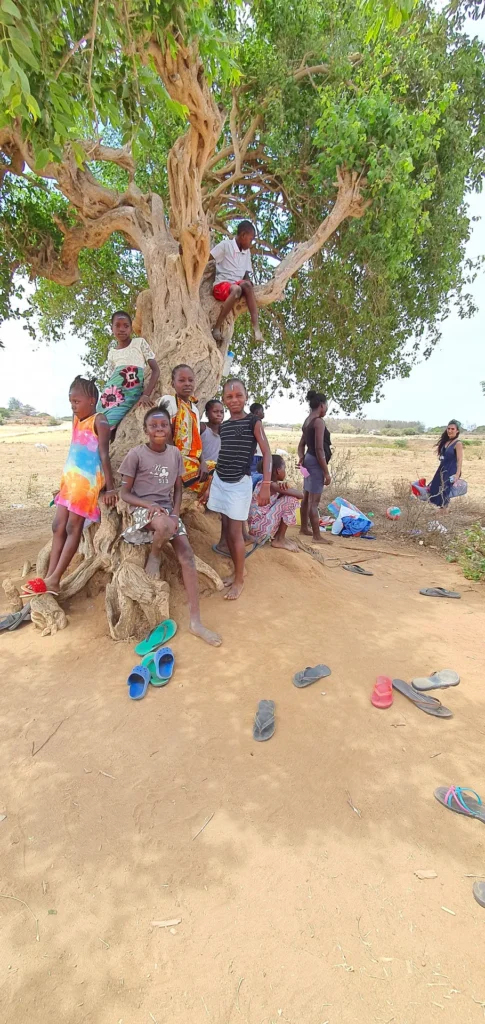 Ministry team members and children outdoors