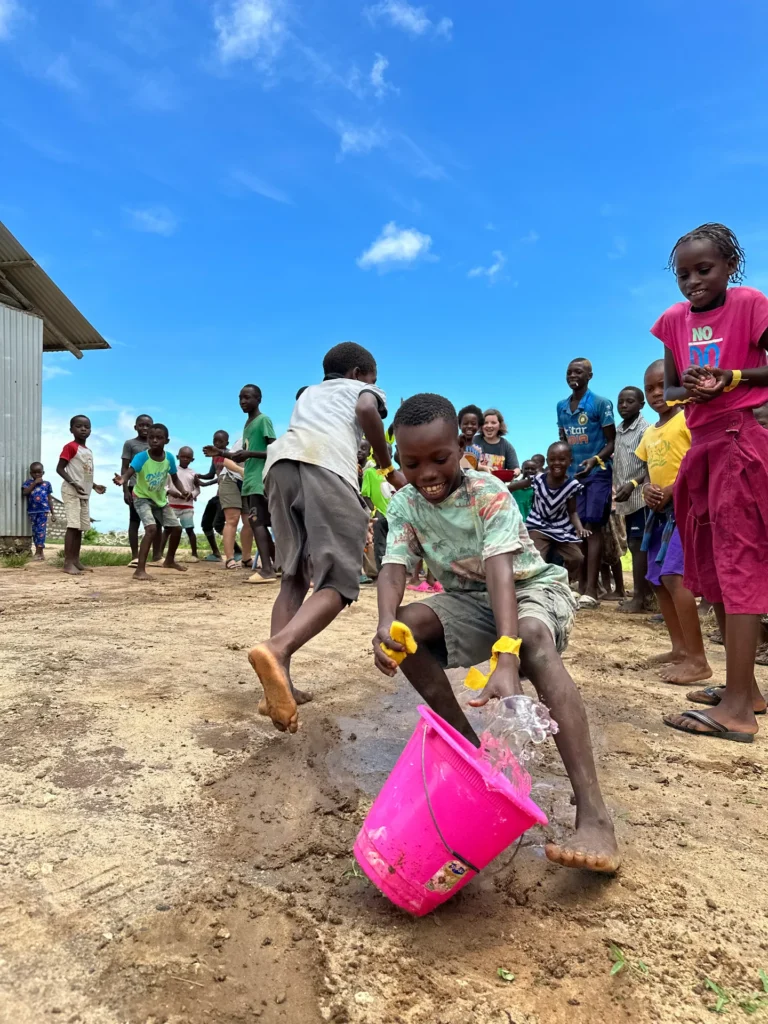 Children participate in a joyful camp relay race