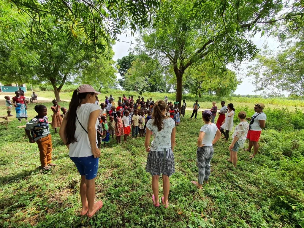 A children’s program held in the shade of trees