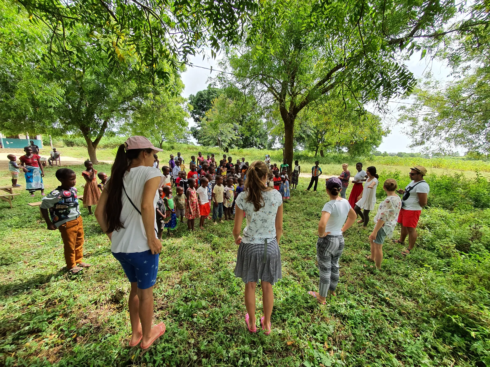 A children’s program held in the shade of trees