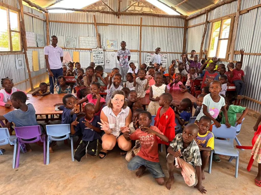 Children and ministry team members inside the camp venue