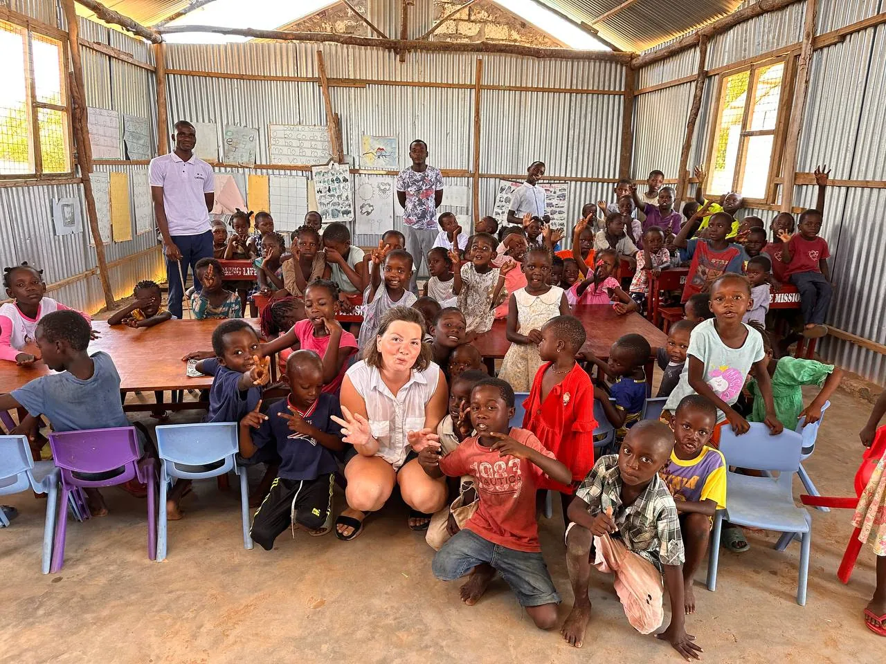 Children and ministry team members inside the camp venue