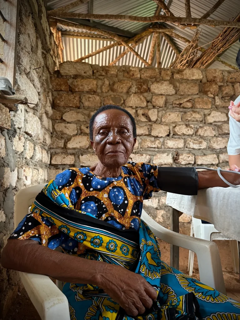 A healthcare worker checks blood pressure during medical outreach in Kenya