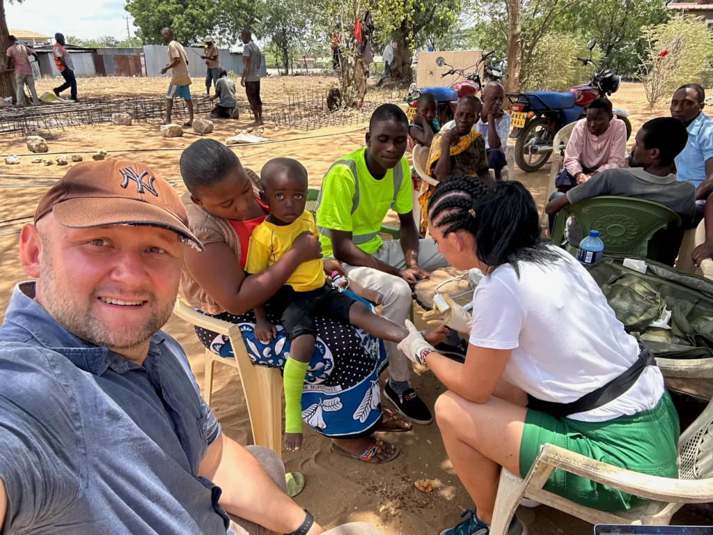 A medical outreach team assists village residents in Kenya
