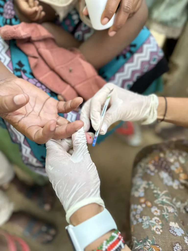 Free medical testing during a village outreach in Kenya