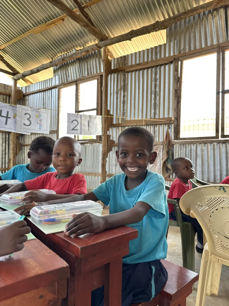 Younger students seated at their desks