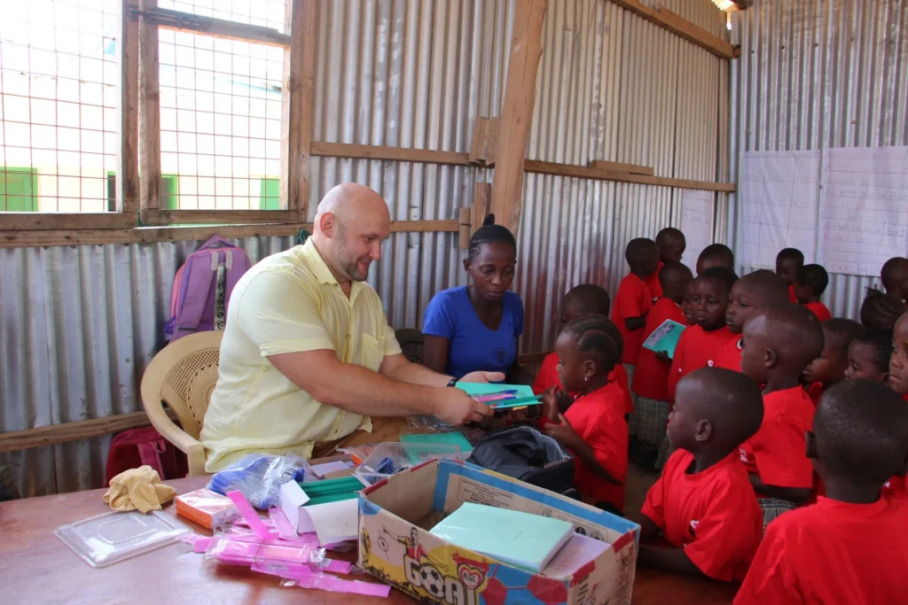 Distributing school supplies to children