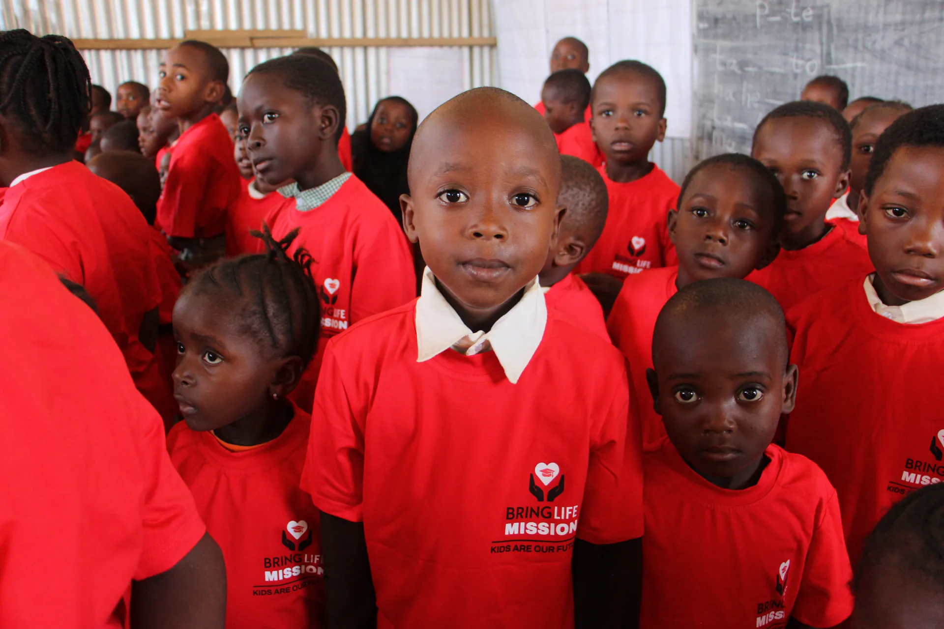 Students wearing red school uniforms