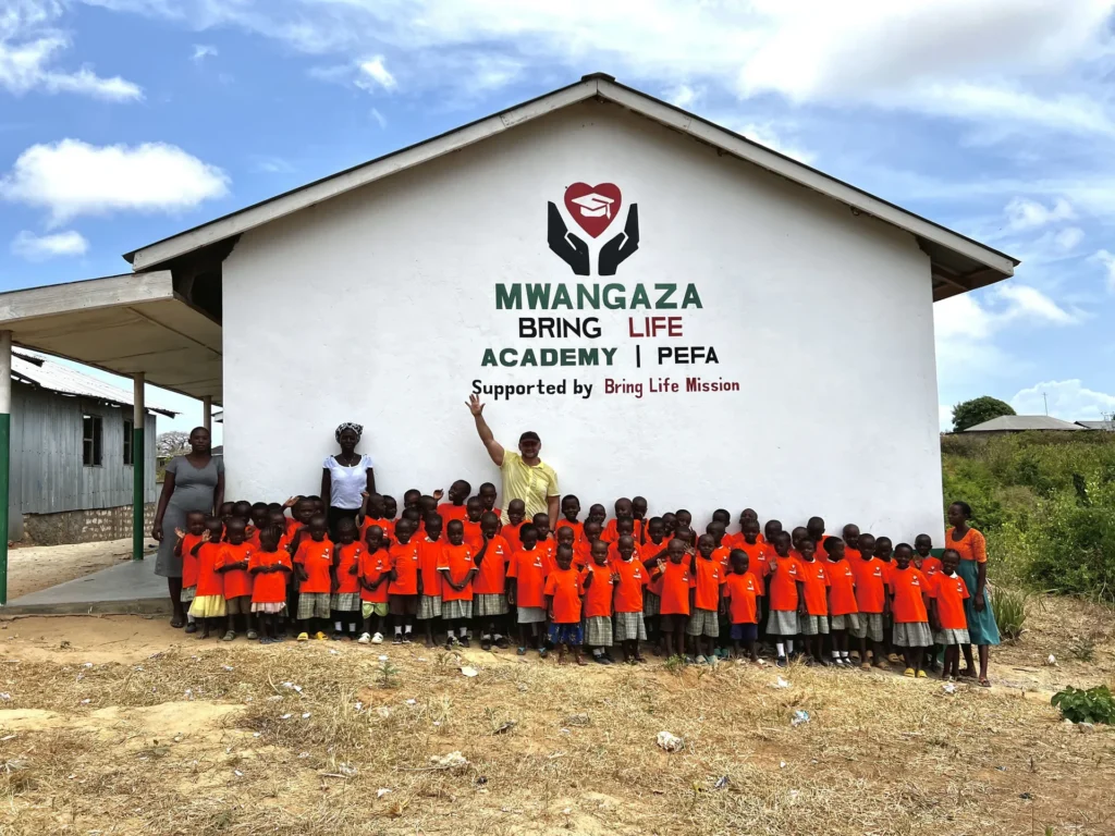 The school community outside Mwangaza Academy
