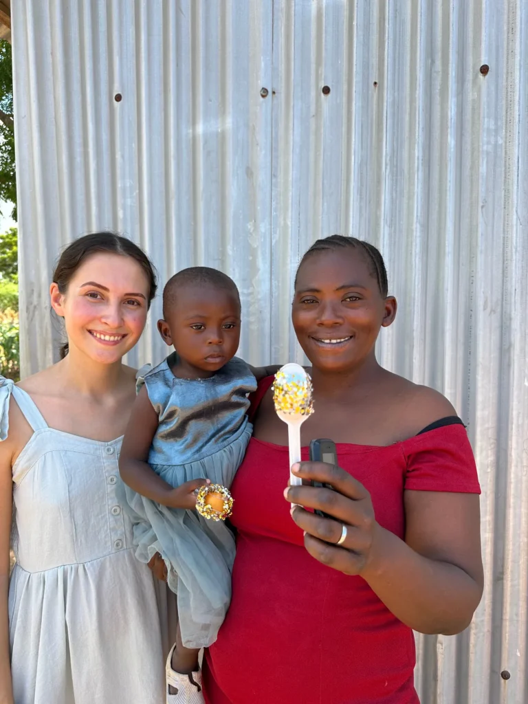A child presents a craft after completing the lesson