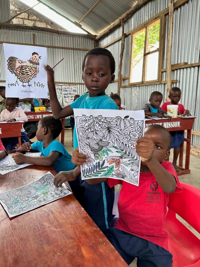 Children with drawings at a class