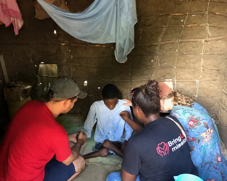 Bring Life Mission team visiting a family in crisis