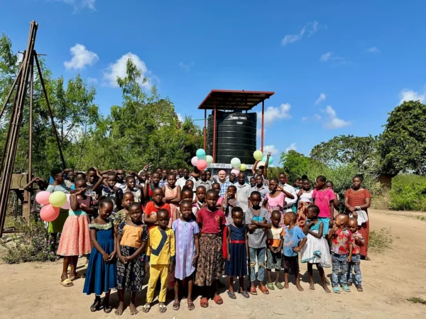 Kenyan village residents gather at a new Bring Life Mission clean-water well