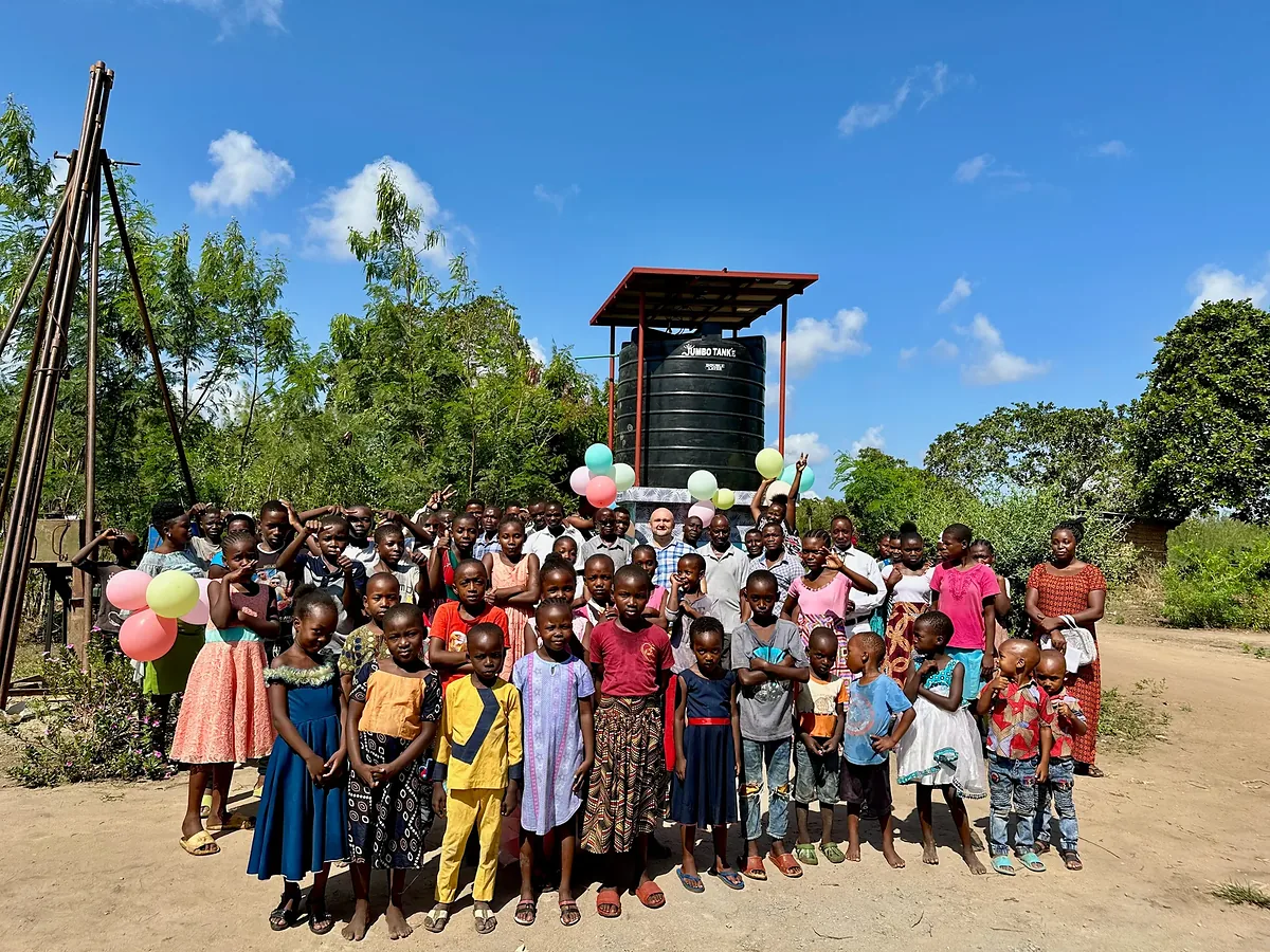 Kenyan village residents gather at a new Bring Life Mission clean-water well