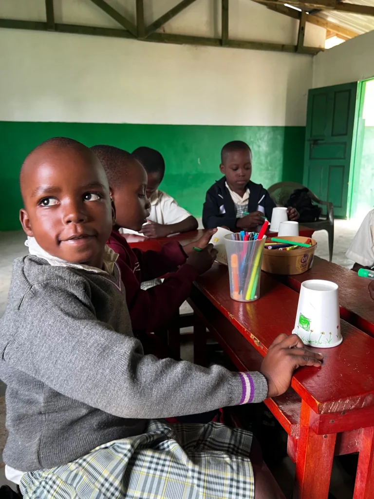 Children showing progress in art and English