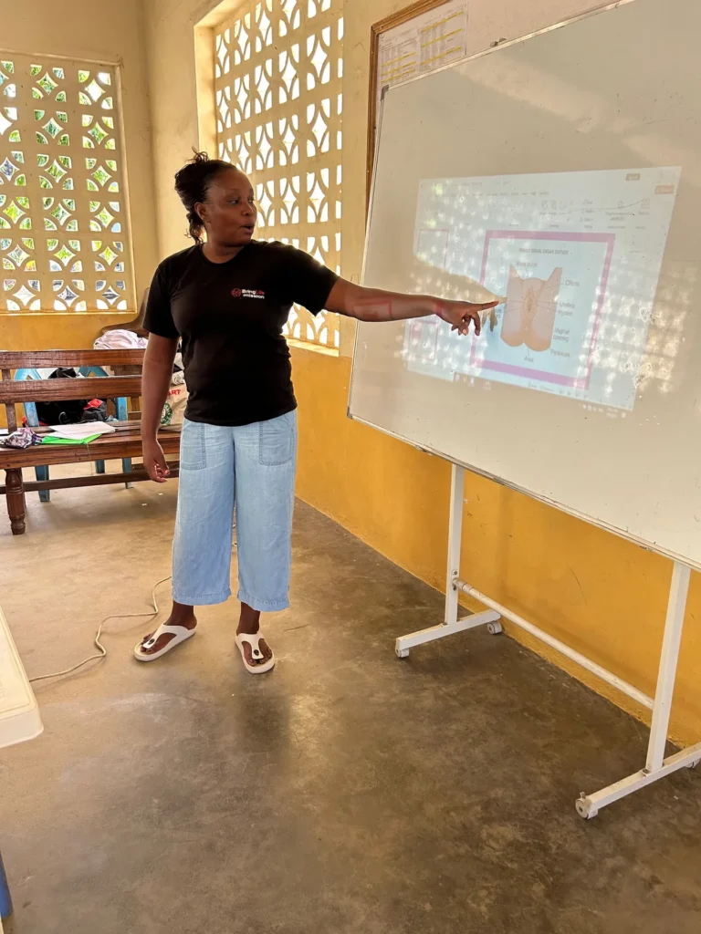 A coach leading a session on growing up and hygiene