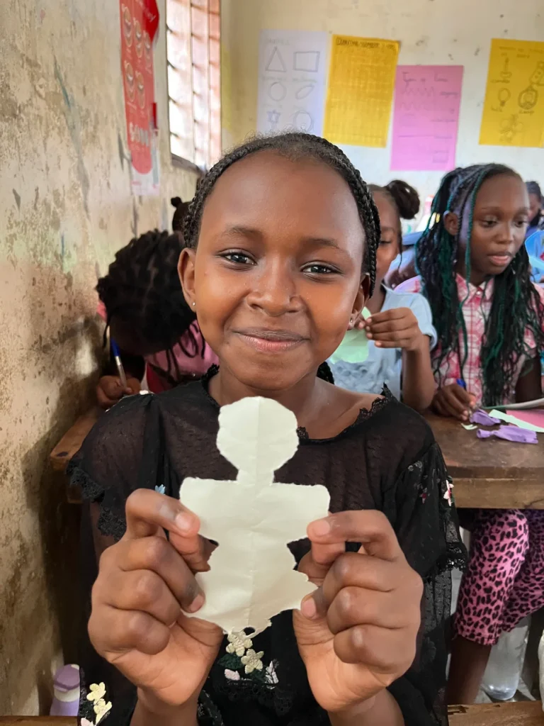 Girl with a set of reusable pads at a youth training
