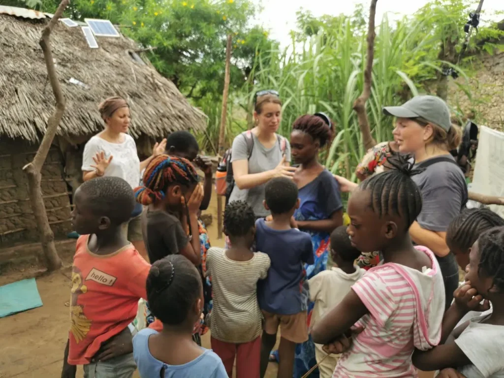 The team prays for a young mother and her children