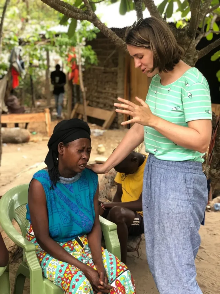 Praying for a woman and her children during a home visit