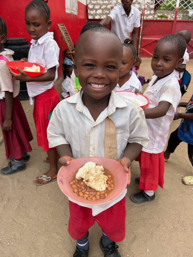 Children receive hot meals in Furunzi