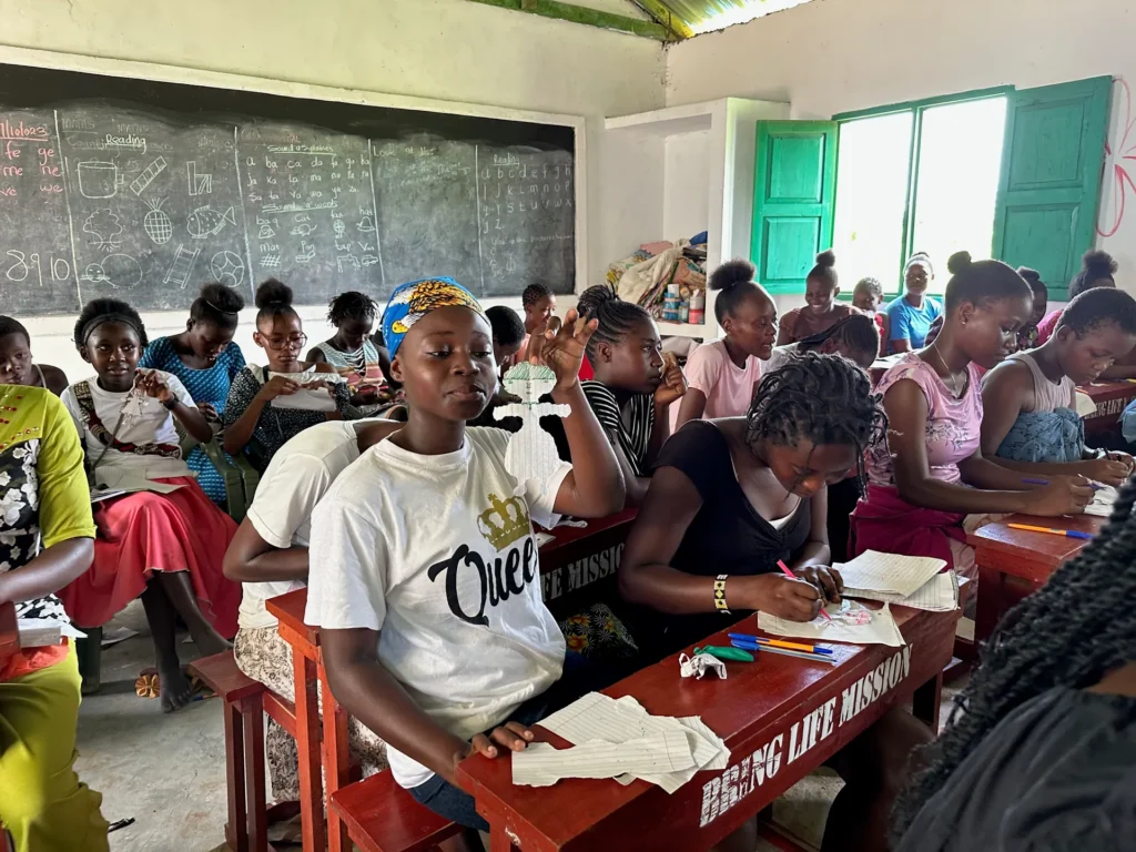 Teenagers at their desks during a youth training