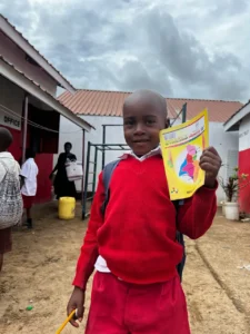 School supply kits including a notebook, pencils, and an eraser prepared for students in Furunzi