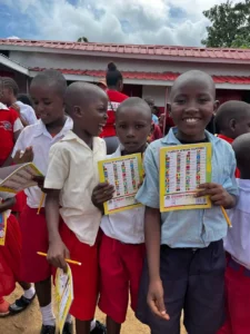School supply kits including a notebook, pencils, and an eraser prepared for students in Furunzi