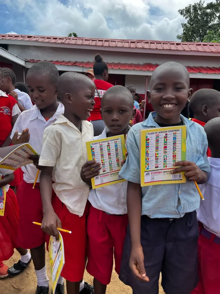 School supply kits including a notebook, pencils, and an eraser prepared for students in Furunzi