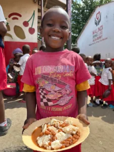 Photo update from the daily free feeding program in the Furunzi slums