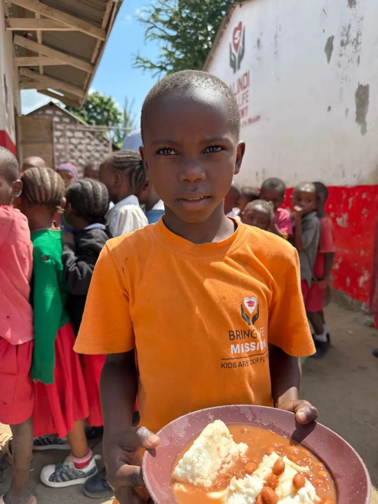 Photo update from the daily free feeding program in the Furunzi slums