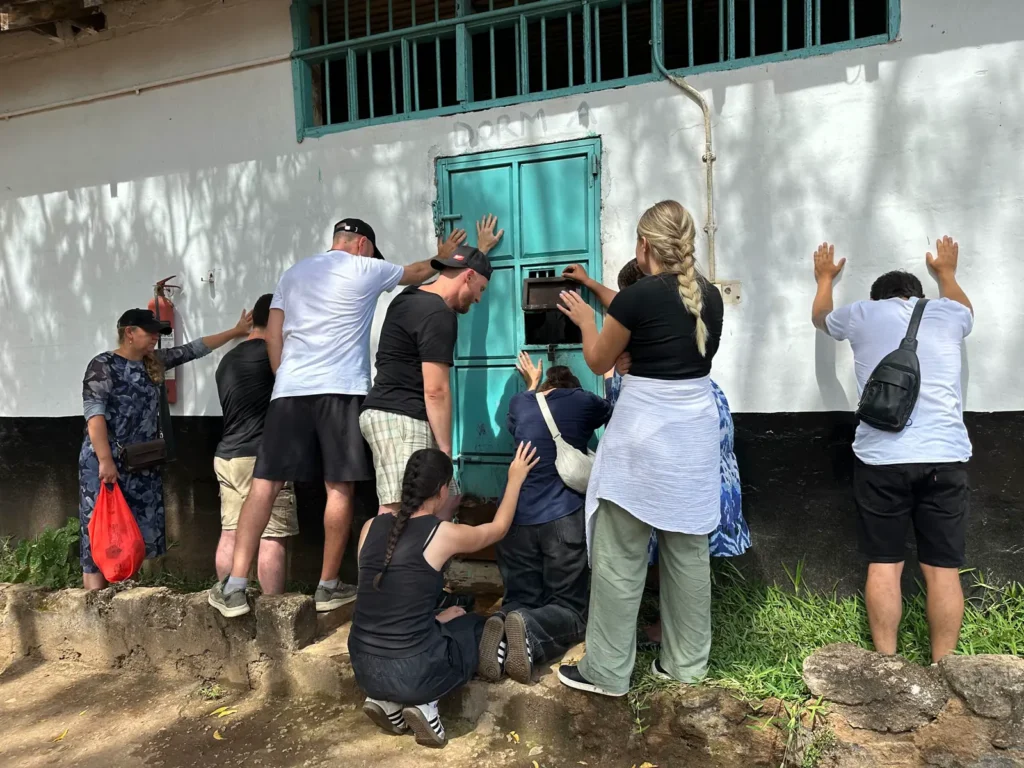 A team prays during a ministry visit at a juvenile detention center