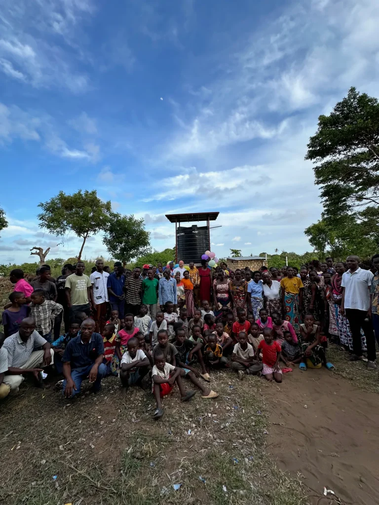 Residents celebrate the opening of a new water well in Masheheni