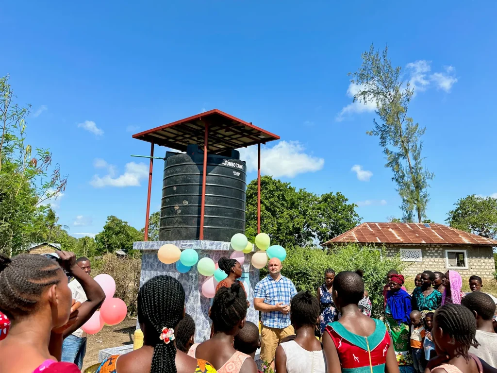 Community celebration at the opening of a new water well in Kenya