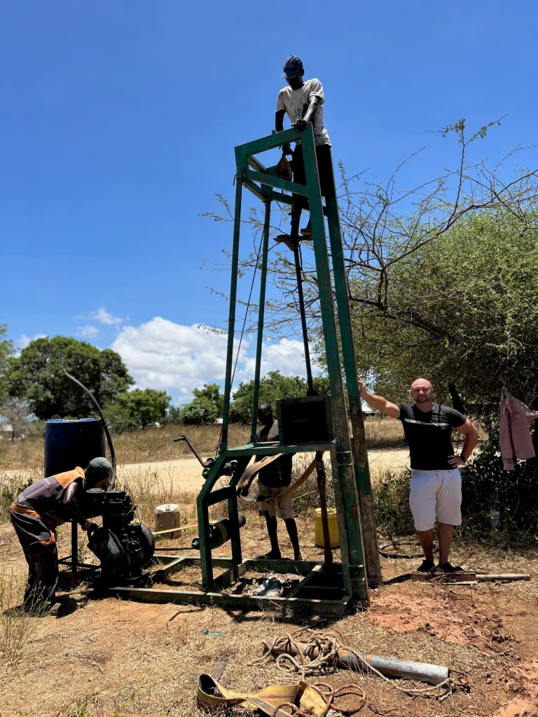 Coordinating a water-well site with the local community in Kenya